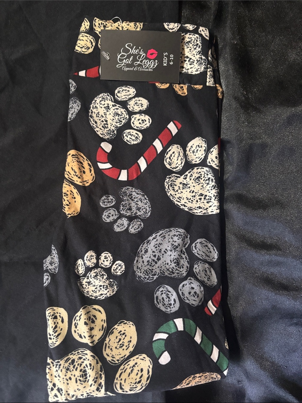 She’s Got Leggz Kids Black Paw Print & Candy Cane Holiday Leggings